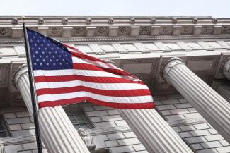 USA flag near municipal building by Brandon Mowinkel courtesy of Unsplash.