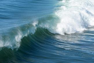 aerial view photography of waves by Pamela Heckel courtesy of Unsplash.